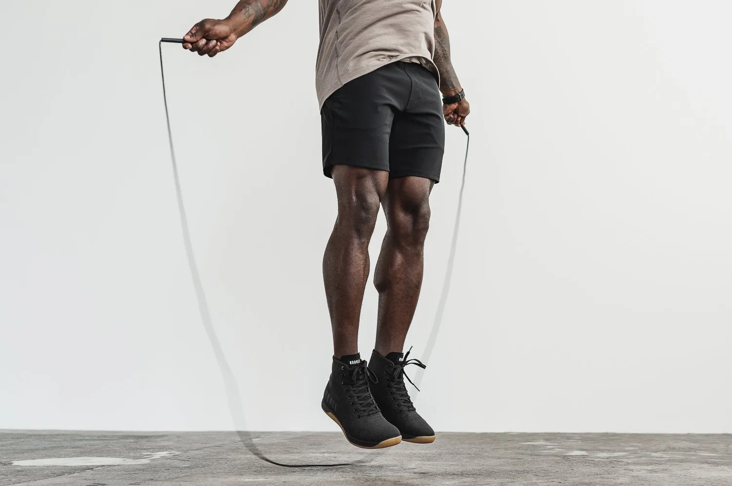 HIGH-TOP BLACK GUM TRAINER (MEN'S)